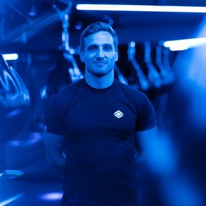 Professional fitness instructor Snizhana Humeniuk smiling.